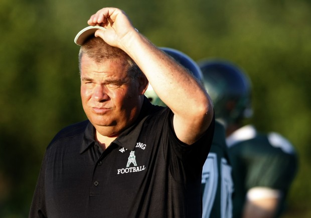 Whiting head coach Jeff Cain watches his team warm up Saturday's game with Clark.